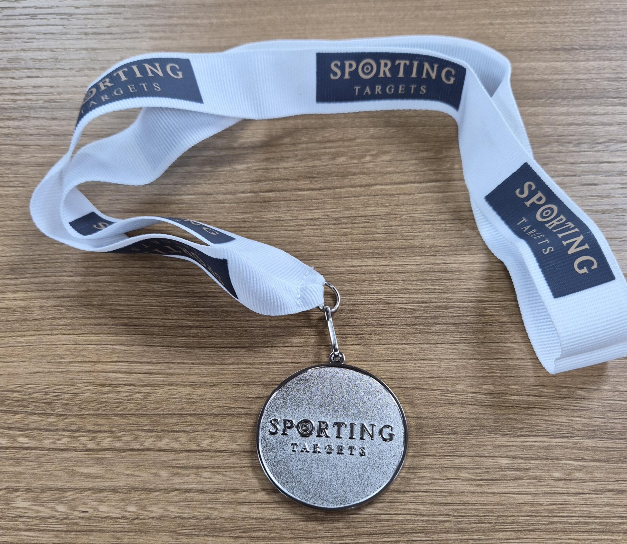 Sporting Targets Medal Nickel plated with White Ribbon And Logo